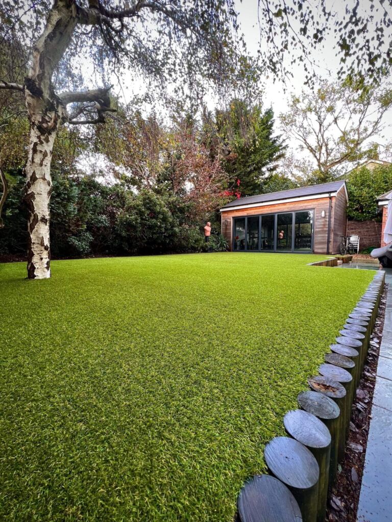 Here's an example of a high top quality artificial lawn installation by Lusher Lawns. This lawn is 5 years old and has had lots of family use, particularly by very active young boys. For reference the grass is Royal Grass Lush 42mm. This photo was taken after an annual service by the Artificial Grass Wizards