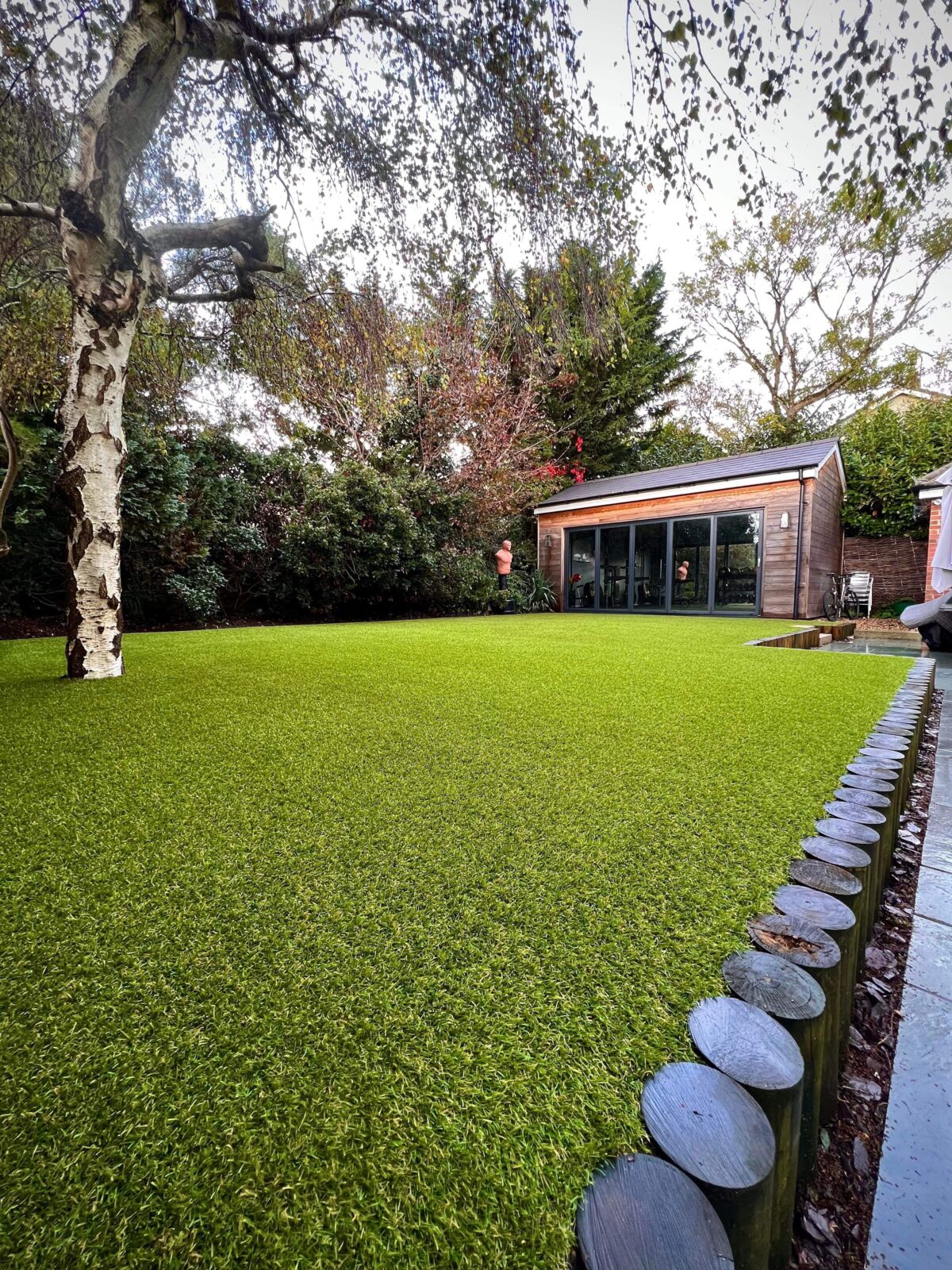 Here's an example of a high top quality artificial lawn installation by Lusher Lawns. This lawn is 5 years old and has had lots of family use, particularly by very active young boys. For reference the grass is Royal Grass Lush 42mm. This photo was taken after an annual service by the Artificial Grass Wizards